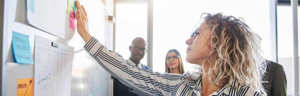 b2b content marketers brainstorming with post it notes on whiteboard