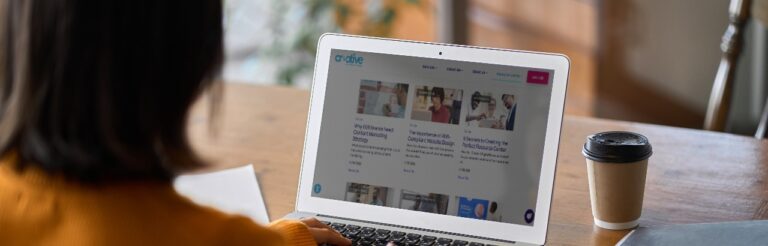 woman looking at resource center on laptop