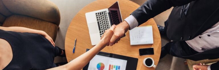 handshake at sales meeting