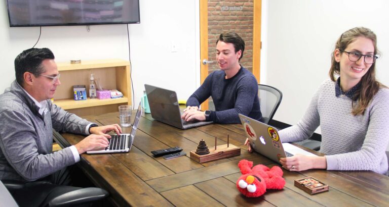 the team at BNP Engage talking around a table