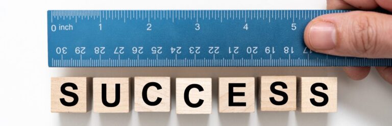 measuring the word success with a ruler