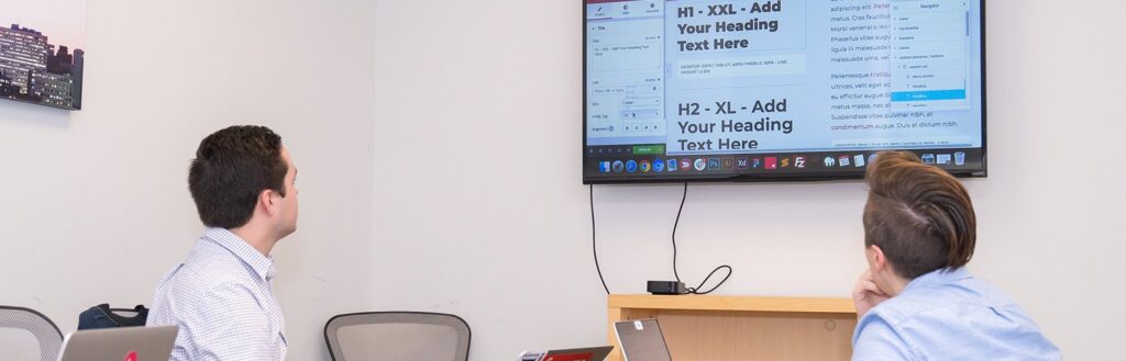 website designers reviewing page structure