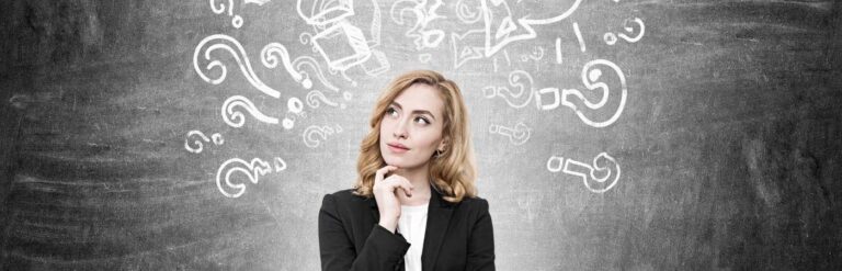 woman thinking with with question marks on whiteboard