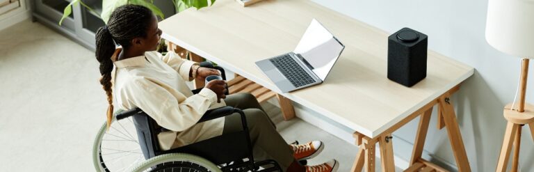 woman in a wheelchair working on laptop