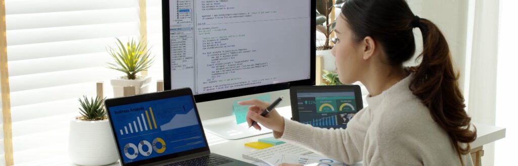 young businesswoman analyzing content marketing metrics and writing code