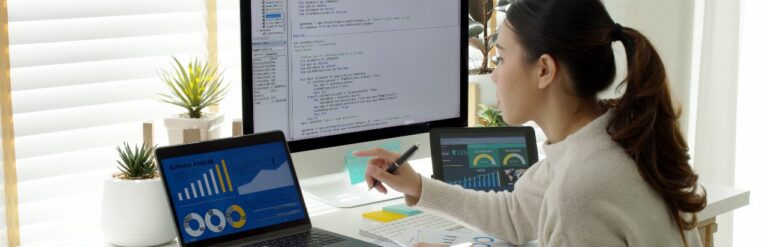 young businesswoman analyzing content marketing metrics and writing code