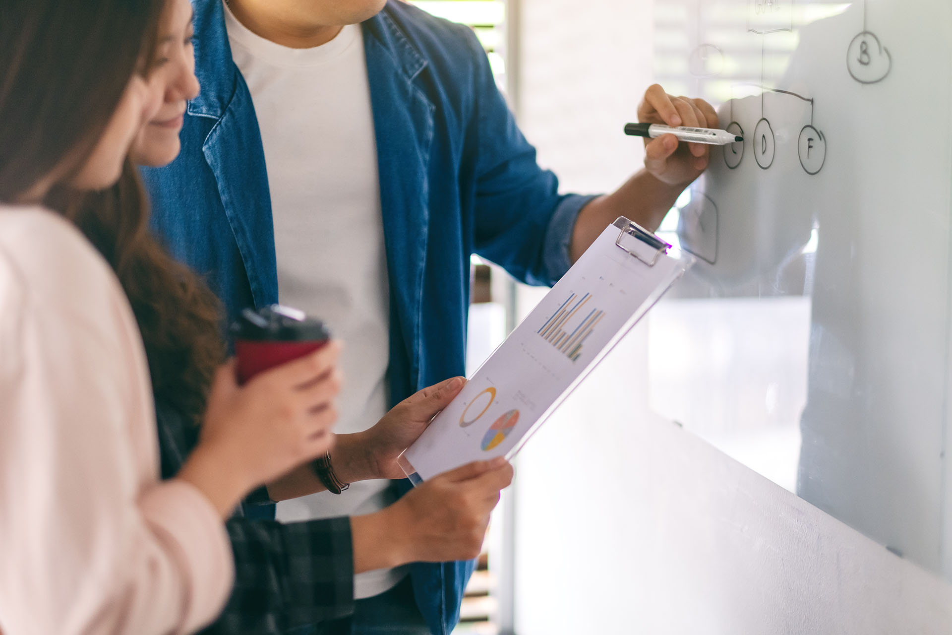 strategizing on whiteboard