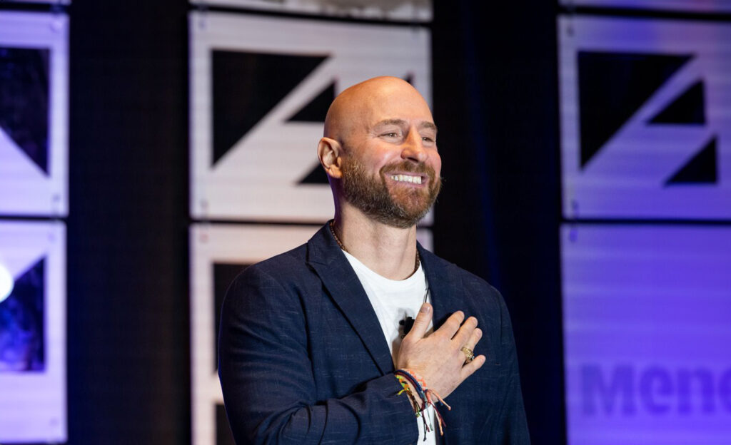 Josh Rizzo presenting on stage