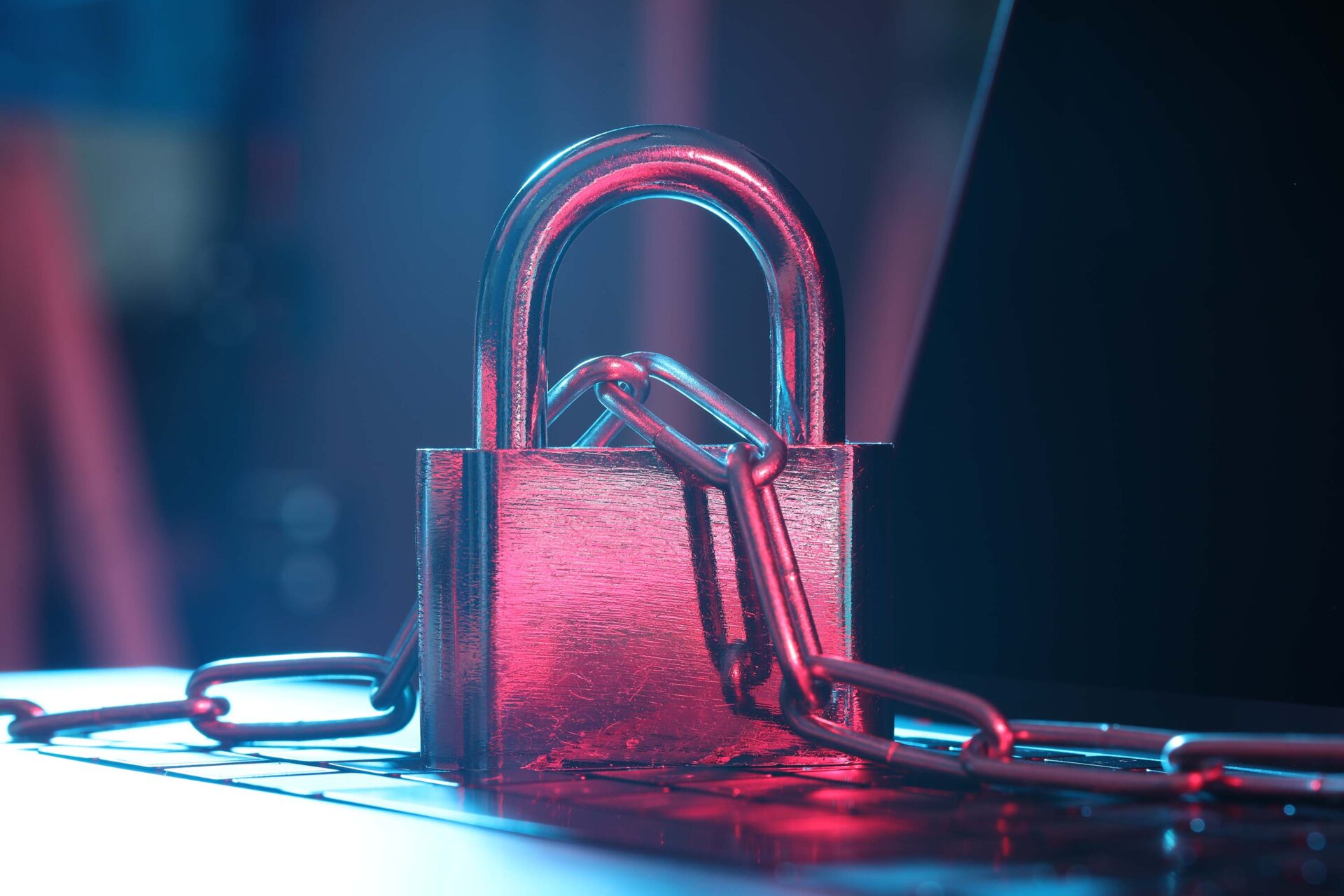 laptop with padlock and chain on keyboard
